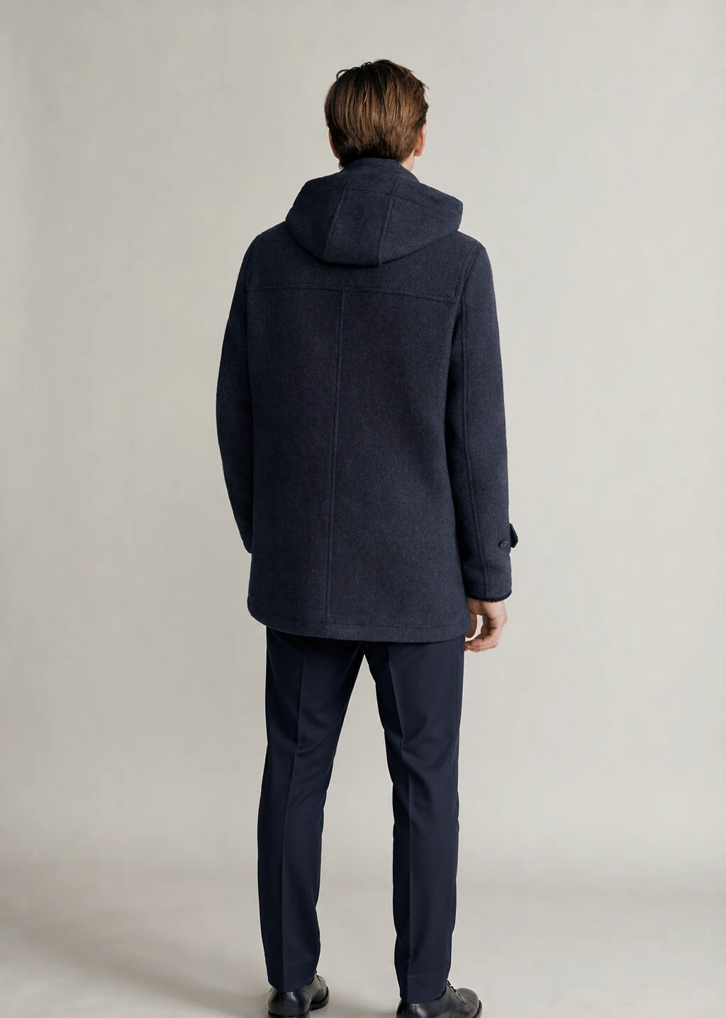 XH26AW2097 Coat Model Back XH26AW2097 mens navy hooded duffle coat model back view - AI generated