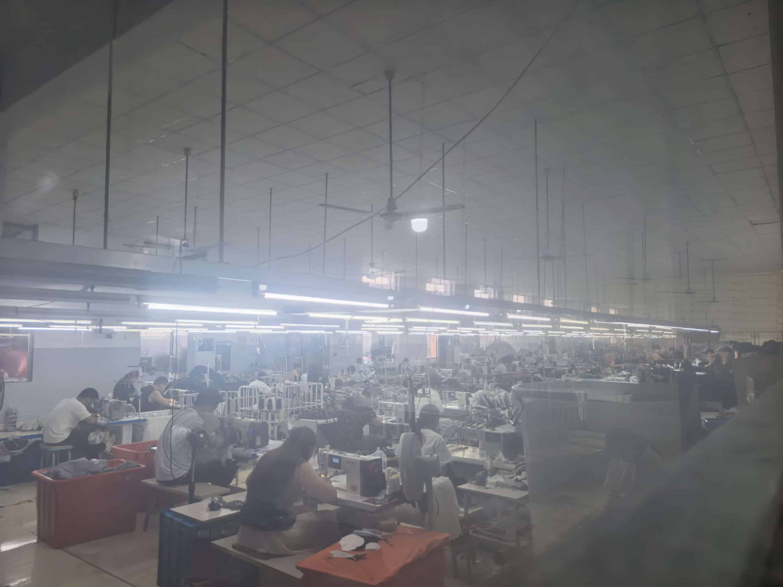 出货中 (5) Busy outerwear sewing line at Xinhua Apparel factory in China