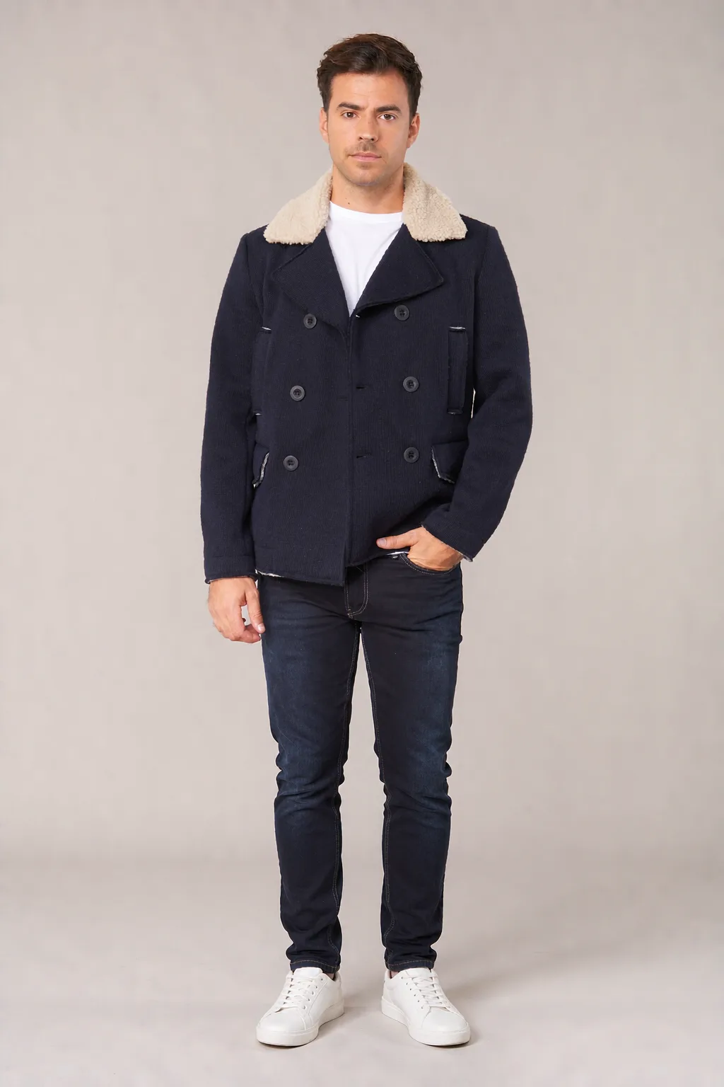 Men's navy wool double-breasted peacoat with cream shearling collar on model - Style #2111