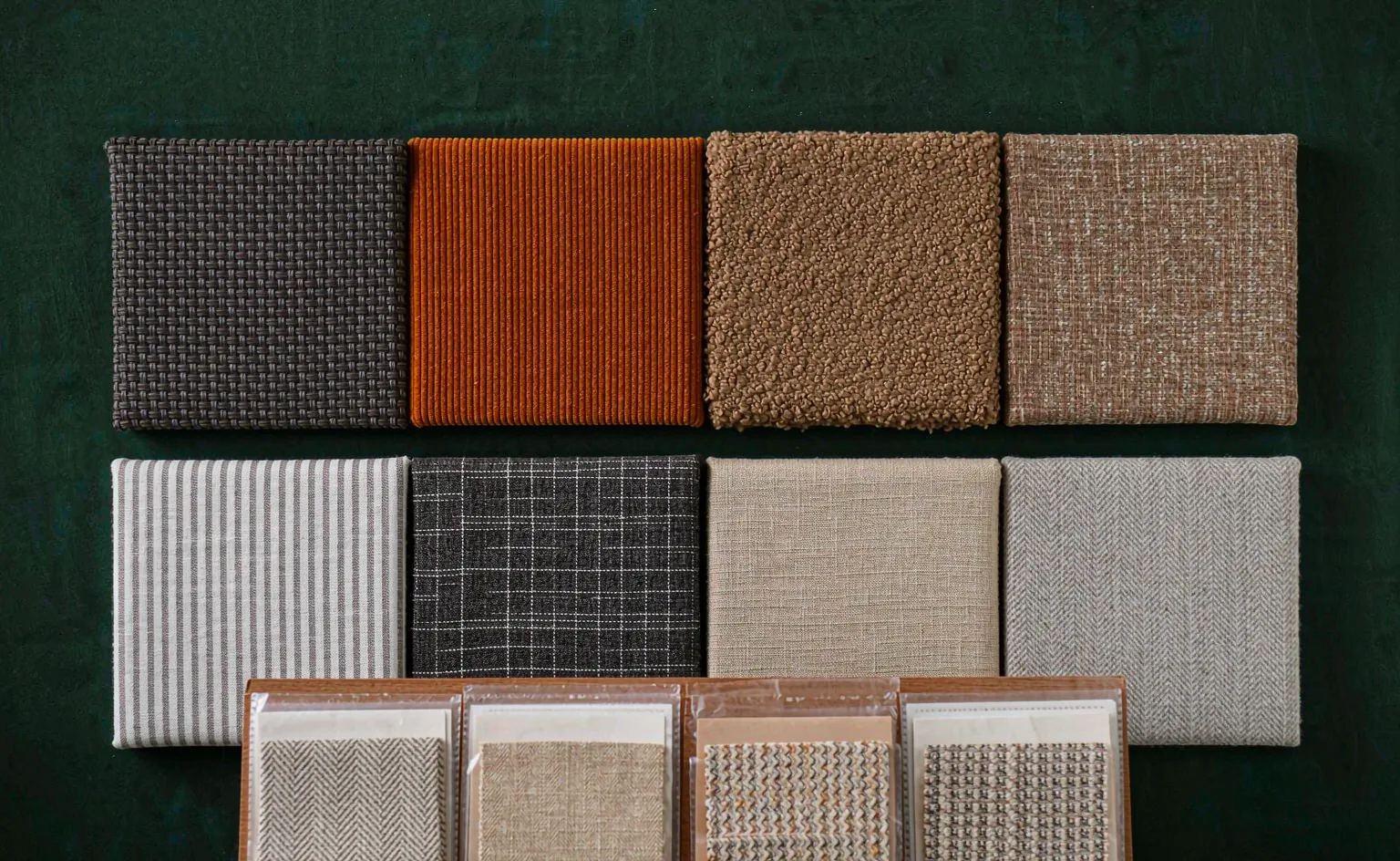 Fabric swatches and color cards pinned on a trend research moodboard wall